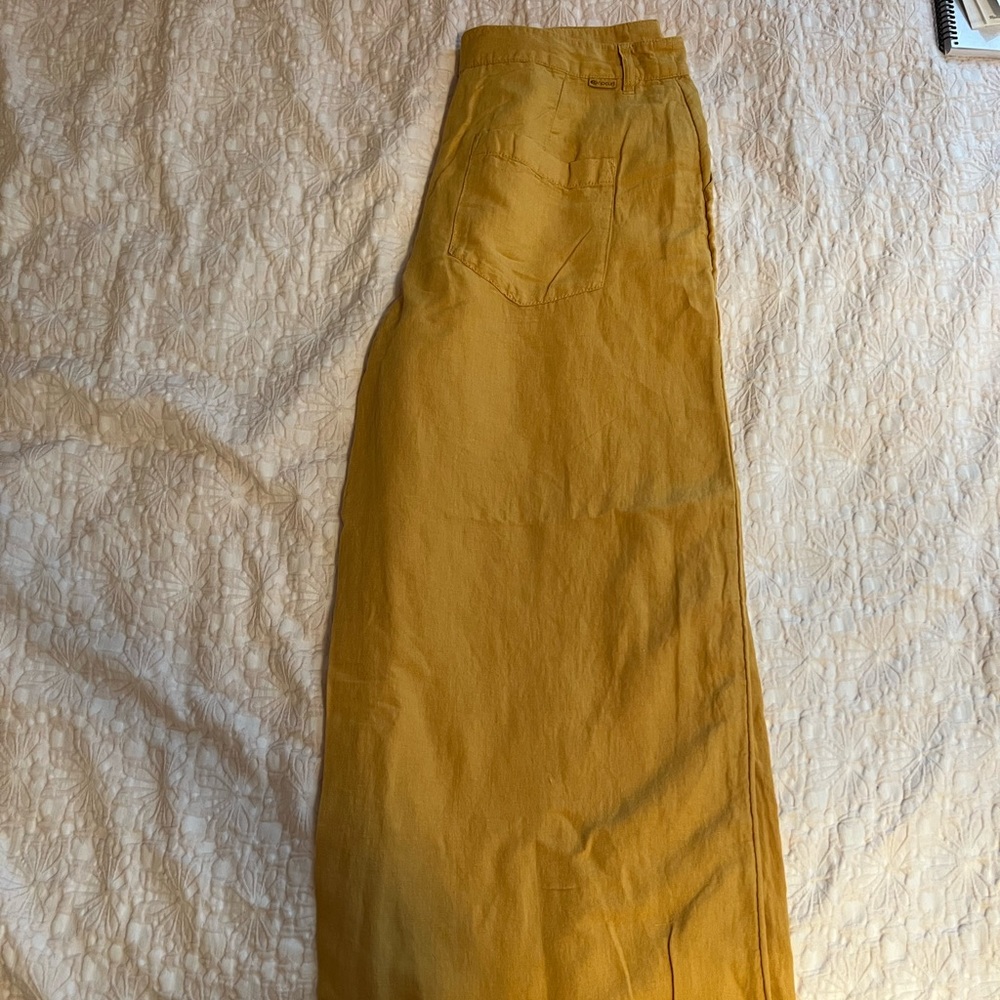 Rip Curl wide-legged linen pants in golden yellow